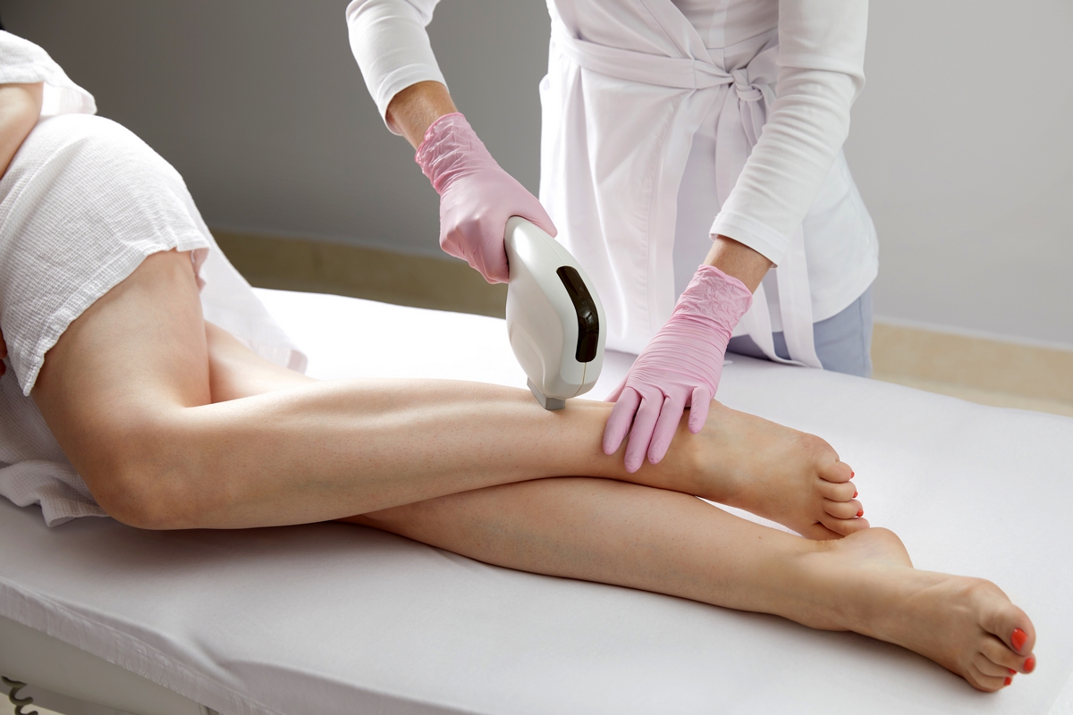 Laser hair removal on ladies legs in beauty salon epilation laser